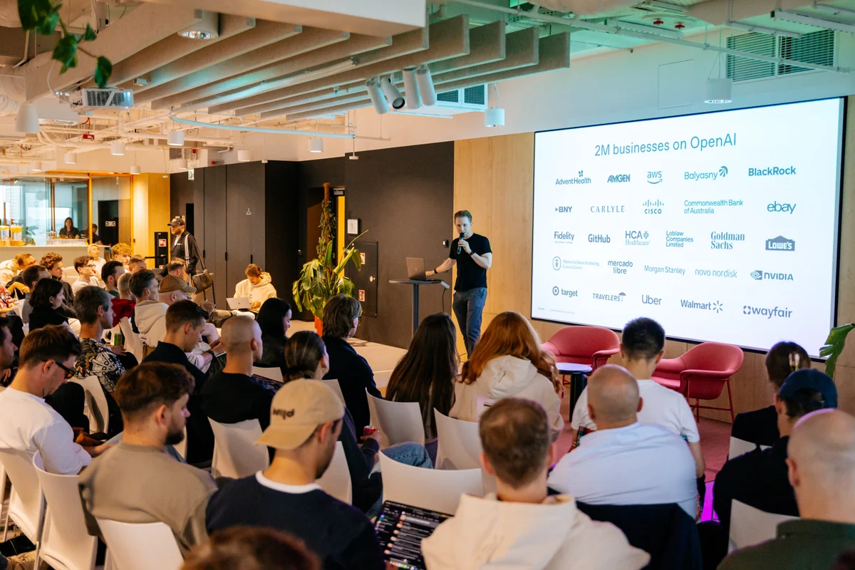 Members listening to an OpenAI presentation at the September GTM Tech Week meetup.